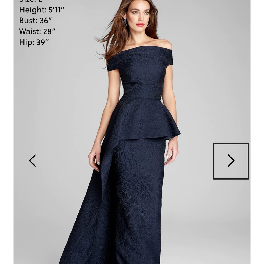Teri Jon for Rickie Freeman .  Navy blue jacquard gown with peplum overlay.